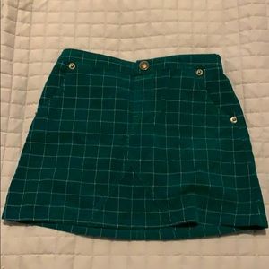Green, corduroy skirt.